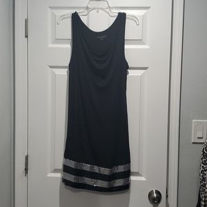 Black dress with sequin detail at bottom.